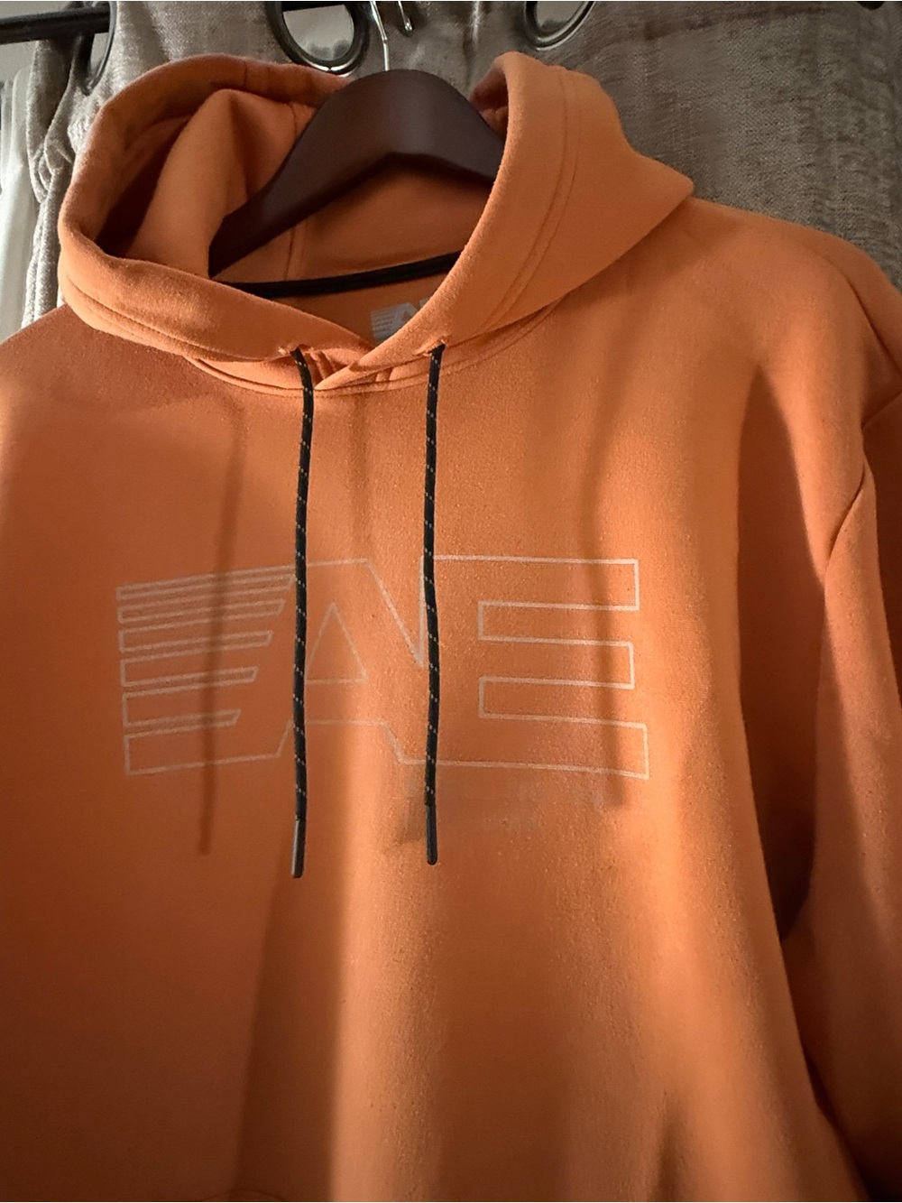 American Eagle Outfitters Orange Pullover Hoodie with Subtle White Logo